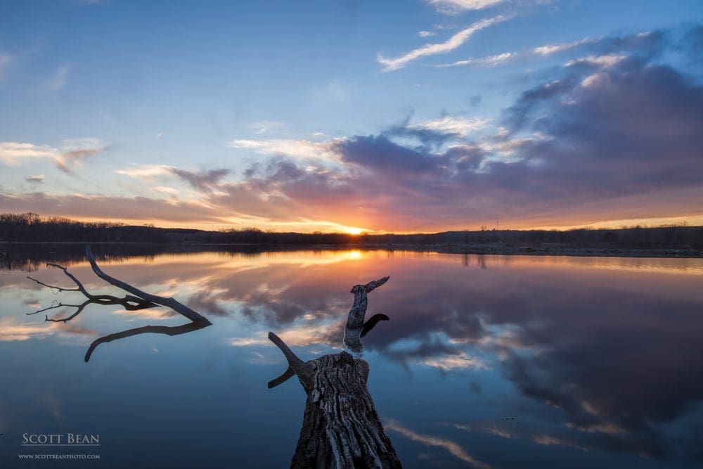 Winter sunset reflected in the River Pond area of Tuttle Creek Lake.